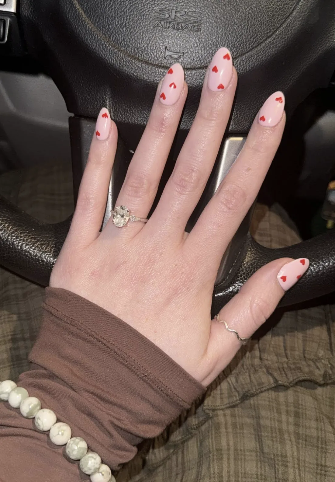 Client's almond nails with red heart nail art